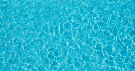 The blue surface of the water beckons with its coolness.