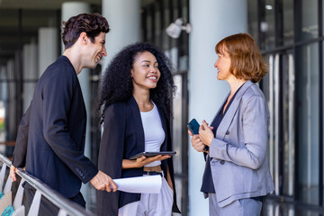 Team of diversity business people are discussing over the new strategic strategy project on investment real estate while walking around the office building for new project and planning