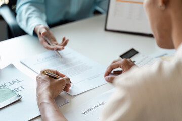 Young Couple Engaged in Financial Planning and Budgeting and signature with Documents and Adviser...