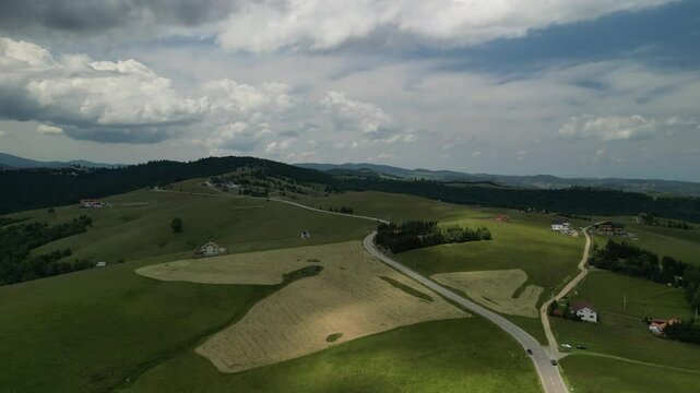 Aerial drone view above the mountain road in Paltinis, in the Carpathian Mountains, Romania.