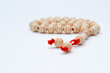 Rosary or prayer beads, isolated on white background
