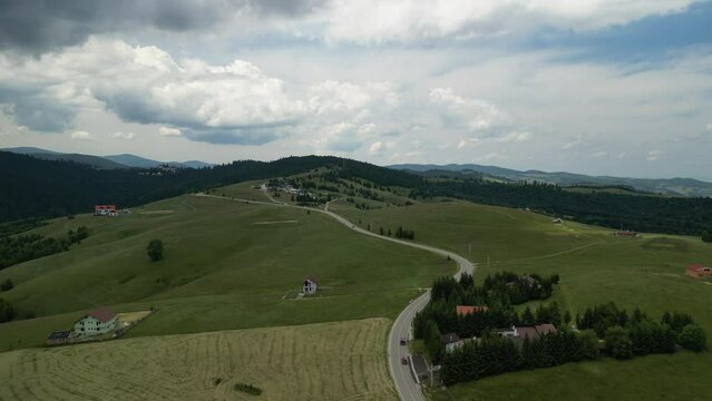Aerial drone view above the mountain road in Paltinis, in the Carpathian Mountains, Romania.