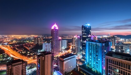 Obraz premium rooftop view night cityscape vibrant neon lights featuring colorful buildings illuminated windows create dynamic futuristic urban scene