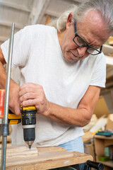 Carpenter artist working on wood craft at workspace. High quality photo