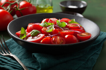 healthy tomato salad with onion basil olive oil and balsamic vinegar