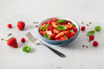 watermelon salad with strawberry raspberry basil seeds. healthy summer dessert