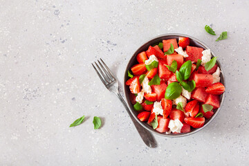 watermelon salad with strawberry mozzarella cheese basil. healthy summer dessert