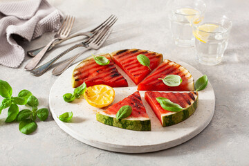 grilled watermelon slices with lemon and basil. summer dessert
