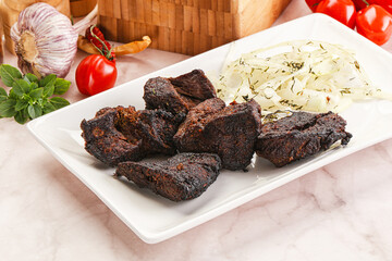 Grilled beef barbecue served onion