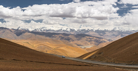 Road of Friendship in Tibet with the view of the mountains and the road