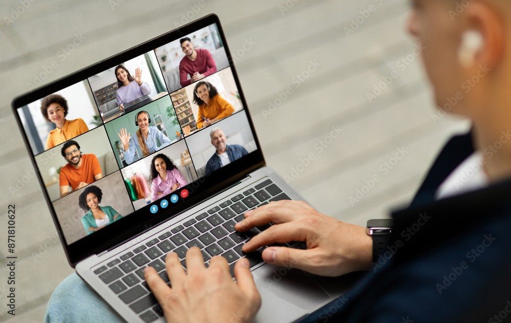 Poster a man sits in front of a laptop computer, actively participating in a video conference meeting. the 