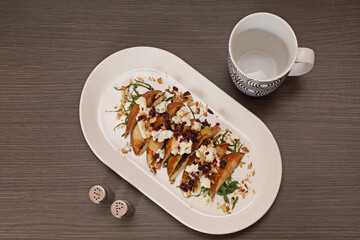 Grilled Pears With Blue Cheese and Walnuts Served at Oval Plate