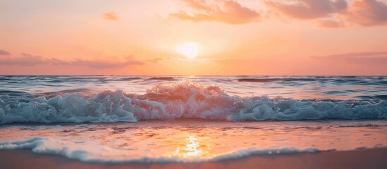 Fototapeta premium Sunset on the ocean shore with waves, creating a picturesque scene with a serene ambiance in the copy space image.