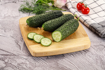 Raw green cucumbers with slices
