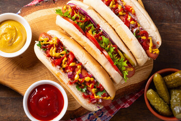 Hot dog . Traditional american food . Top view on wooden background