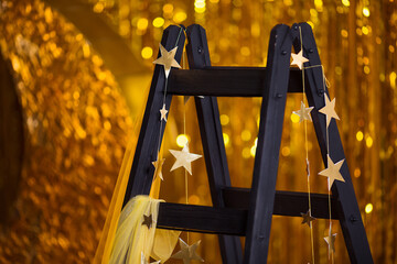 Gold Glitter Photo Booth with Crescent Moon and Stars adds glamour, impressing guests at any event