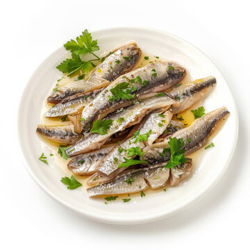 A serving of Spanish boquerones en vinagre, marinated anchovy fillets with vinegar, garlic, and parsley, isolated on white background.