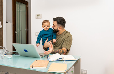 Man Working from Home with Baby on Laptop