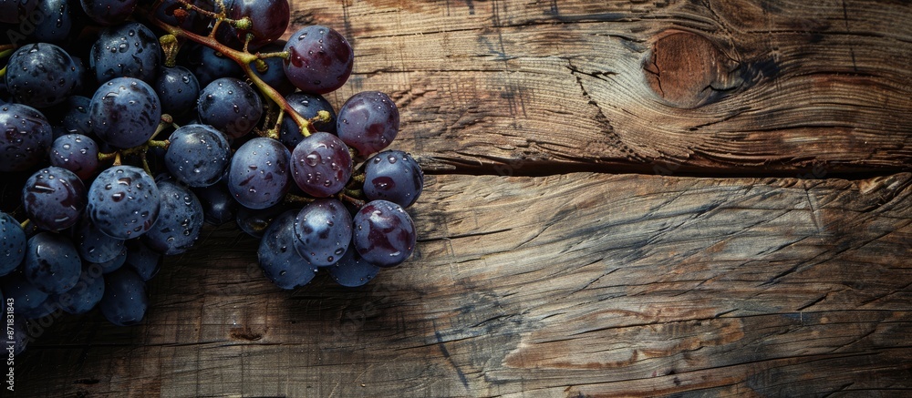 Poster close-up of grapes on a wooden background with copy space image.
