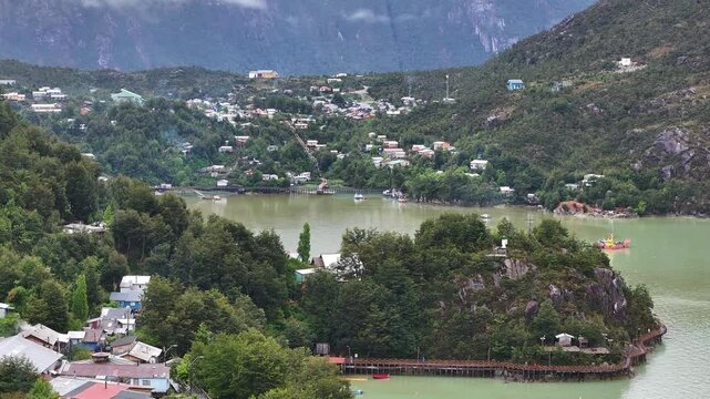 Aerial View of Caleta Tortel, Coastal Village and Bay in Misty Landscape of Chile, Drone Shot 60fps