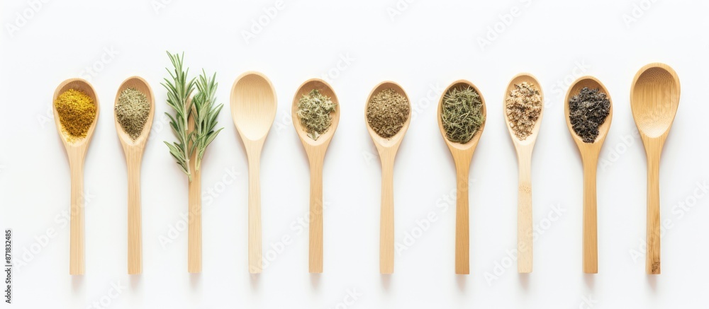 Poster bamboo spoons with herbal leaves and powdered herbs displayed on a white wooden table with a blank s