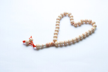 Rosary or prayer beads, isolated on white background	