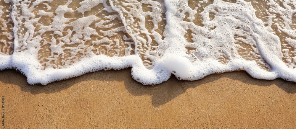 Poster detailed view of sand with a gentle wave, presenting a serene coastal scene alongside a copy space i