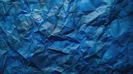 Obraz premium Textured blue crumpled paper from top view