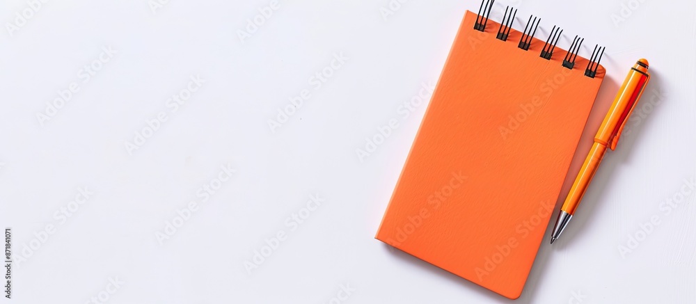 Poster an orange notepad stands alone on a blank white backdrop, perfect for a copy space image.