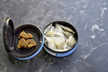 A box of snus pads is a substitute for smokeless cigarettes. Swedish nicotine pouche