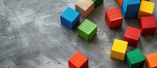 Child's game designer against gray background with various colors; copy space image available.