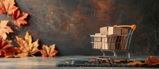 Autumn themed sales promotions featuring a mini cart filled with wooden cubes on a chalkboard with a fall background, ideal for a copy space image.