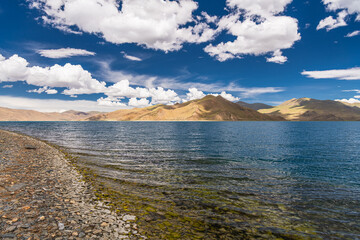 Shadow of Cloud over the clear turquoise lake, at Yamdrok Lake, Tibet, China. Copy space for text
