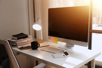 messy office workspace. Messy and cluttered office desk. Messy business office with piles of files and disorganized clutter.
