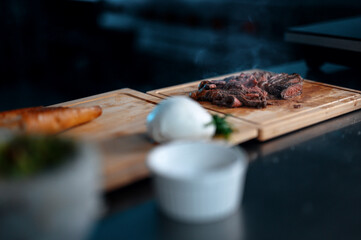 Meat on steak with smoke