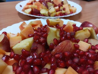 Slice of ripe papaya.Yellow papaya cut into two pieces.A black papaya seed inside a papaya., A black papaya seed inside a papaya slice.,mix cutting sweet fruits pieces 