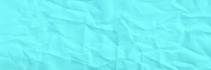Obraz premium Texture of crumpled parchment or paper. Abstract background for design. turquoise paper, Valentine's Day background, craft paper, craft material, festive packaging, blank turquoise background vector.