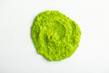 Smoothie with fresh green vegetables and fruitsclose-up on a white background. Berry and yogurt ice cream. The texture of the sorbet. Delicious sweet dessert close-up as a background.