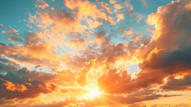 Golden evening sunset with sun behind clouds vast sky panorama