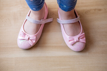 sparkly pink shoes represents the small triumphs and milestones that children experience as they gain independence