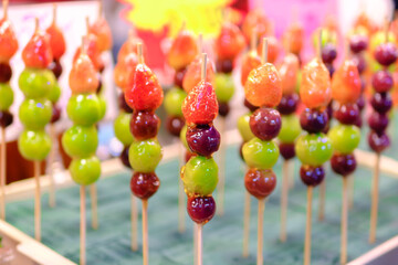 Beautifully arranged sugar-coated grape and strawberry. Tang Hu Lu