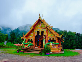 ๋June 24 2024, Nan, Thailand : Beautiful Sapan Temple in the middle of a valley amidst nature with morning mist.