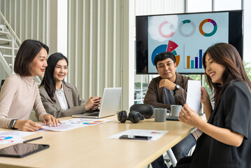 Happy diverse group Asian business start up freelance team analyzing statistics financial. Group Team of business people meeting conference discussion various topic corporate concept in office.