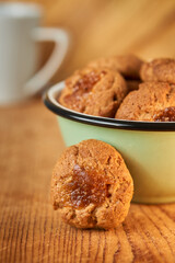 A bowl with pepas cookies on a table