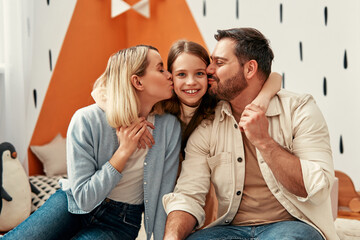 Happy family with parents and daughter in a modern living room, radiating affection and happiness