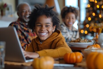 Happy child using a laptop with family during a festive gathering.