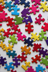 Obraz premium Colorful jigsaw puzzle pieces on white background. Flat lay.