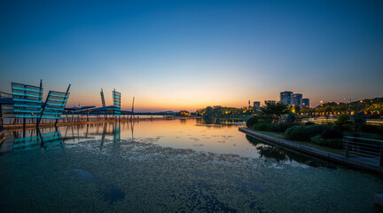 Serene Sunset Over Modern Waterfront