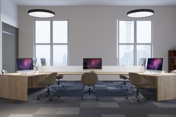 Modern office corner, white walls, computer desks