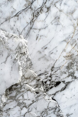 Close-up of elegant white marble texture with grey veins, showcasing natural patterns and intricate details, perfect for backgrounds or interior design.